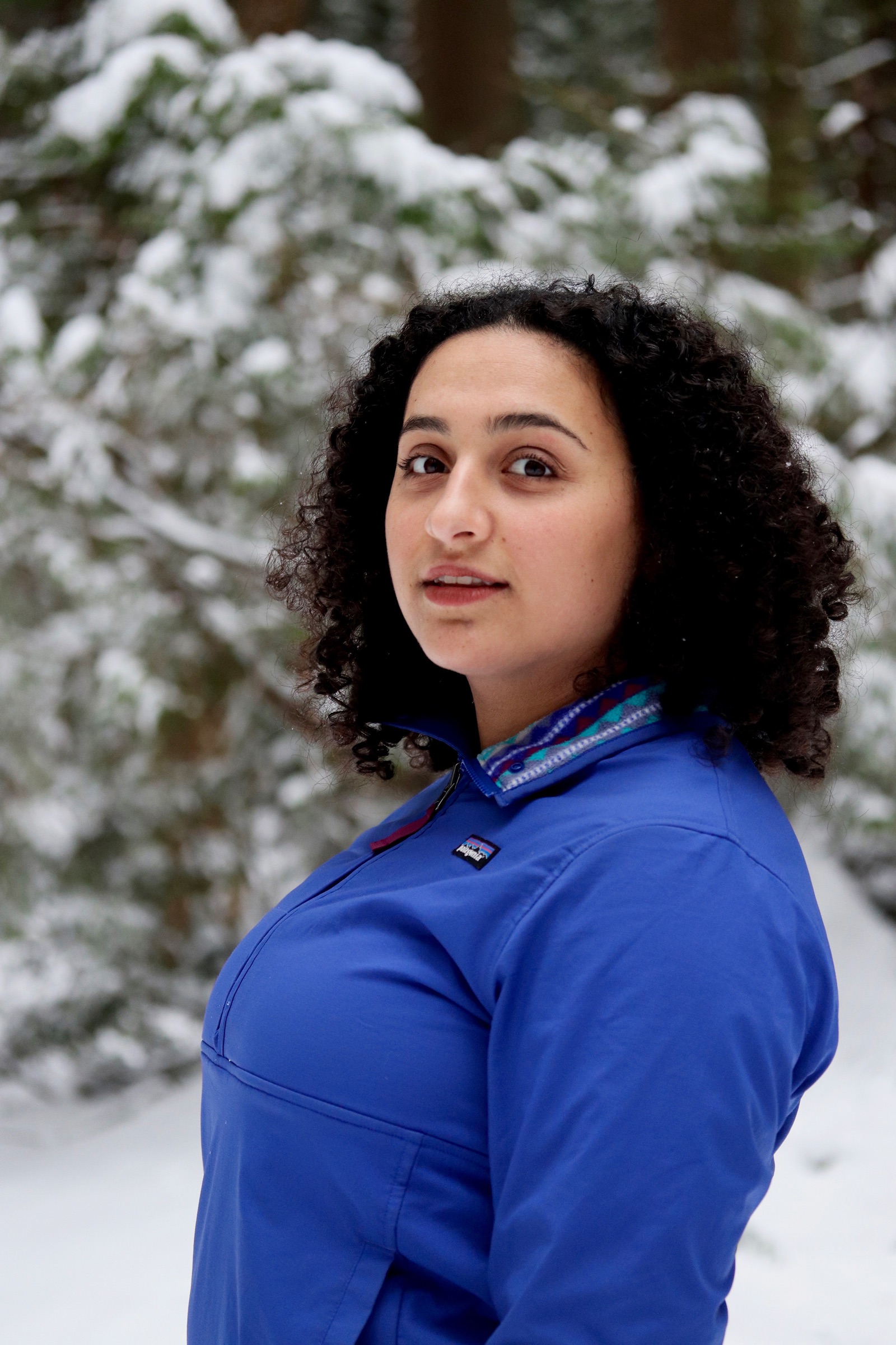 Women headshot in snowy park scene